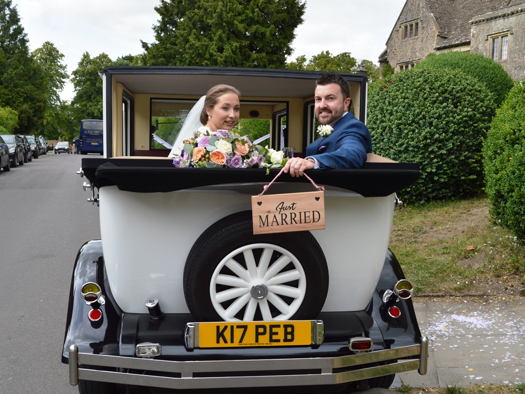 Harriet & Dan in Imperial wedding car at St Mary's Church Purton