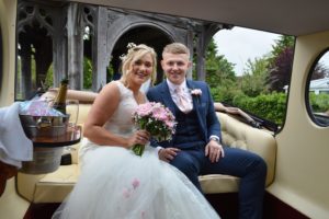 Lauren & Jake in Imperial wedding car at Hullavington Church