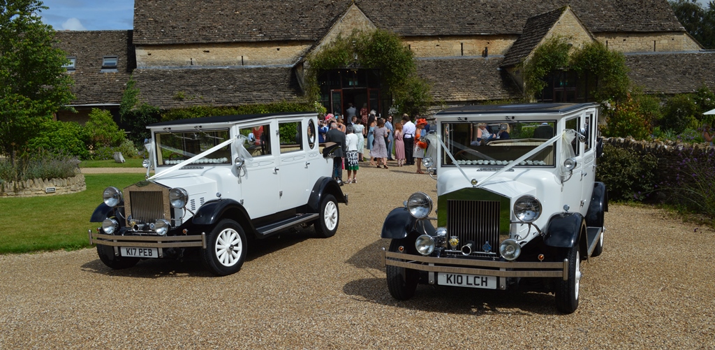 The Great Tythe Barn with two Imperial wedding cars